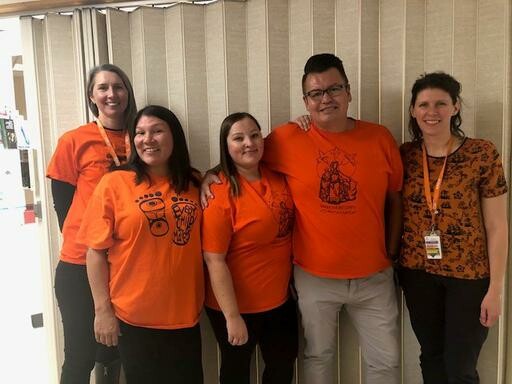Five team members from the Royal Alexandra Hospital all wearing orange for Orange Shirt Day 2019.