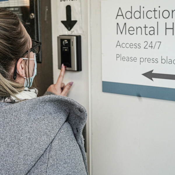 A woman checks into the Addiction and Mental Health Access 24/7 centre.